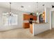 Kitchen with wood cabinets, granite counters, and black appliances at 3614 Summerwind Cir, Bradenton, FL 34209