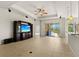 Living room with built-in entertainment center and sliding glass doors at 3614 Summerwind Cir, Bradenton, FL 34209