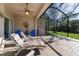 Relaxing screened porch with patio furniture and ceiling fan at 3614 Summerwind Cir, Bradenton, FL 34209