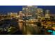 Luxury waterfront condo building with city views at night at 401 Quay Commons # 901, Sarasota, FL 34236