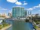 Aerial view of waterfront highrise building with city views and boat slips at 401 Quay Commons # 901, Sarasota, FL 34236