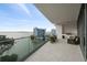 Spacious balcony with outdoor furniture and water views at 401 Quay Commons # 901, Sarasota, FL 34236