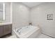 Bathroom featuring a luxurious soaking tub at 401 Quay Commons # 901, Sarasota, FL 34236