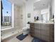 Spa-like bathroom with glass shower and modern vanity at 401 Quay Commons # 901, Sarasota, FL 34236