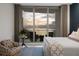 Bedroom with stunning sunset views and comfortable seating at 401 Quay Commons # 901, Sarasota, FL 34236