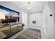 Bright condo entryway with decorative mirror at 401 Quay Commons # 901, Sarasota, FL 34236