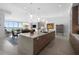 Open concept kitchen with large island and views to the dining and living areas at 401 Quay Commons # 901, Sarasota, FL 34236