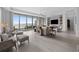 Bright living room with water views, hardwood floors, and comfortable seating at 401 Quay Commons # 901, Sarasota, FL 34236