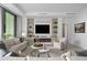 Spacious living room featuring a modern fireplace and built-in shelving at 401 Quay Commons # 901, Sarasota, FL 34236