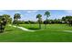 Scenic golf course with lush green fairways and mature trees at 4628 Pine Green Trl # 9, Sarasota, FL 34241