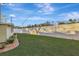 Backyard view with grassy area and concrete wall at 5101 Island Date St, Sarasota, FL 34232