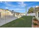 Backyard with grassy area and privacy fence at 5101 Island Date St, Sarasota, FL 34232