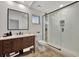 Modern bathroom with glass shower and dark wood vanity at 5101 Island Date St, Sarasota, FL 34232