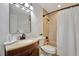 Clean bathroom with a tub shower, vanity, and updated fixtures at 5101 Island Date St, Sarasota, FL 34232