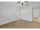 Spacious bedroom with wood-look flooring and access to bathroom at 5101 Island Date St, Sarasota, FL 34232