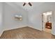 Bright bedroom with wood-look flooring and ceiling fan at 5101 Island Date St, Sarasota, FL 34232