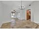 Dining room with tile floor and view into kitchen and living room at 5101 Island Date St, Sarasota, FL 34232