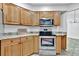 Updated kitchen with granite countertops and wood cabinets at 5101 Island Date St, Sarasota, FL 34232