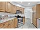 Kitchen boasts granite counters, stainless steel appliances at 5101 Island Date St, Sarasota, FL 34232