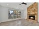 Spacious living room with a stone fireplace and hardwood floors at 5101 Island Date St, Sarasota, FL 34232