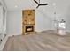 Living room featuring a stone fireplace, hardwood floors, and high ceilings at 5101 Island Date St, Sarasota, FL 34232