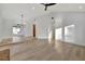 Open living area with hardwood floors and access to other rooms at 5101 Island Date St, Sarasota, FL 34232