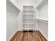 Spacious walk-in closet with built-in shelving and hanging rods at 5101 Island Date St, Sarasota, FL 34232