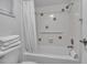 Clean bathroom with shower/tub, white tile, and white linens at 5311 Gulf Of Mexico Dr # 6, Longboat Key, FL 34228