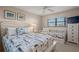 Bedroom with a queen bed, built-in daybed, and dresser at 5750 Midnight Pass Rd # 105E, Sarasota, FL 34242