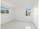 Bright bedroom with terrazzo flooring and window views at 6015 Union Pl, Bradenton, FL 34207