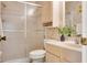 Bathroom with a shower, toilet, and light wood vanity at 6190 80Th N St # 111, St Petersburg, FL 33709