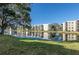 Waterfront community view, featuring a lake and lush green landscaping at 6190 80Th N St # 111, St Petersburg, FL 33709