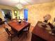 Formal dining room with hardwood flooring, an elegant chandelier, and a wood dining table at 6207 Courtside Dr # 23, Bradenton, FL 34210