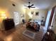 Spacious main bedroom with ceiling fan, wooden furniture, and soft lighting at 6207 Courtside Dr # 23, Bradenton, FL 34210