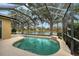 Sparkling pool within a screened enclosure, offering a refreshing escape with a tranquil water view at 6476 Royal Tern Cir, Lakewood Ranch, FL 34202