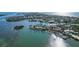Wide aerial view of waterfront homes and community at 6516 Bayou Hammock Rd, Longboat Key, FL 34228