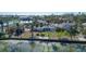 Aerial view of a waterfront home with storm damage at 6516 Bayou Hammock Rd, Longboat Key, FL 34228