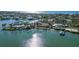 Aerial view of waterfront property with surrounding homes and lush landscaping at 6516 Bayou Hammock Rd, Longboat Key, FL 34228