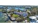 Aerial view of waterfront home with hurricane damage at 6516 Bayou Hammock Rd, Longboat Key, FL 34228