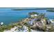 Aerial view of waterfront property with storm damage at 6516 Bayou Hammock Rd, Longboat Key, FL 34228