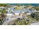 Aerial image showing a house with significant storm damage at 6516 Bayou Hammock Rd, Longboat Key, FL 34228