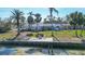 Aerial view of waterfront home with storm damage at 6516 Bayou Hammock Rd, Longboat Key, FL 34228