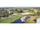 Aerial view of golf course and pond at 6609 Stone River Rd # 104, Bradenton, FL 34203