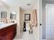 Bright bathroom with updated vanity and toilet at 6609 Stone River Rd # 104, Bradenton, FL 34203