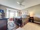 Main bedroom with a king-size bed, ample natural light, and an inviting atmosphere at 6609 Stone River Rd # 104, Bradenton, FL 34203