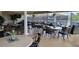 Community patio with tables and chairs at 6609 Stone River Rd # 104, Bradenton, FL 34203