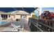 Poolside concessions with shaded seating nearby at 6609 Stone River Rd # 104, Bradenton, FL 34203