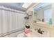 Clean bathroom with updated vanity, shower, and storage at 718 N Jefferson Ave # 718, Sarasota, FL 34237