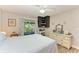 Bedroom with a twin bed, ceiling fan and a view of the patio at 718 N Jefferson Ave # 718, Sarasota, FL 34237
