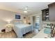 Comfortable bedroom with a queen-size bed, ceiling fan, and private access to patio at 718 N Jefferson Ave # 718, Sarasota, FL 34237